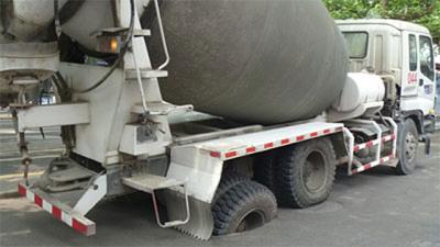 A Twelve-Ton Cement Truck Stuck In The Road