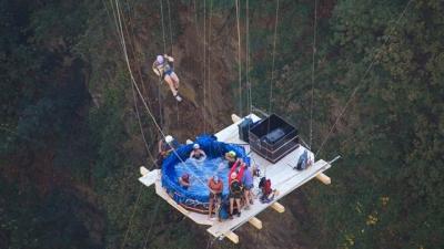 Crazy Swiss Swingers Suspend Hot Tub From Bridge