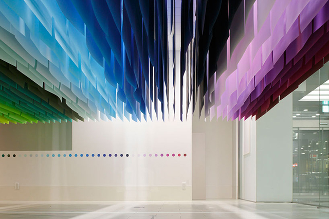 A Giant Paper Installation That Looks Like Sitting Inside A Rainbow