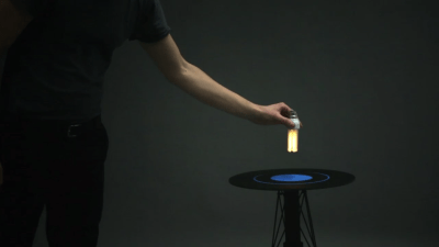 This Magical Table’s Electromagnetic Field Turns On Nearby Light Bulbs