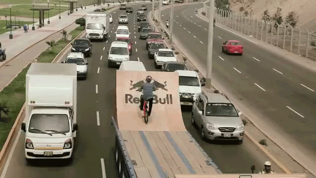 Doing Bike Tricks Off A Moving Truck Half Pipe Seems Brilliantly Nuts