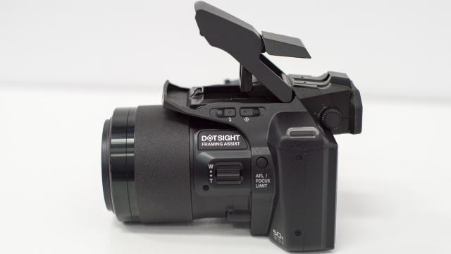 Olympus SP-100 Is A 50X Superzoom Camera With A Red Dot Sight Like A Gun
