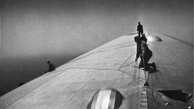 Men Fixing A Zeppelin In Mid-Flight Over The Atlantic