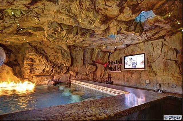 From The Playboy Mansion To YOLO Estate: The Lure Of Backyard Grottos