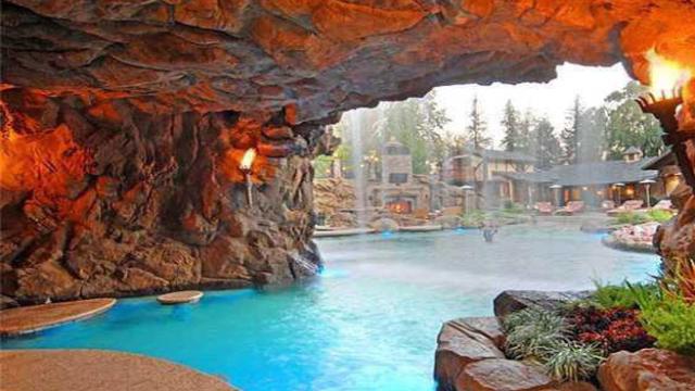 From The Playboy Mansion To YOLO Estate: The Lure Of Backyard Grottos