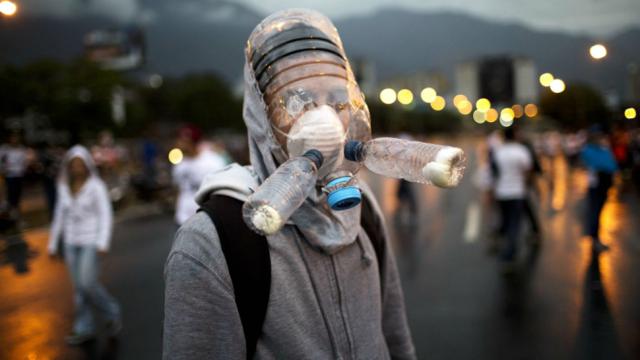 Protesters Cobble Together Gas Masks Out Of Water Bottles