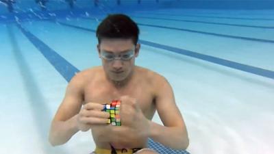 Genius Fish Human Solves Three Rubik’s Cubes Underwater In One Minute
