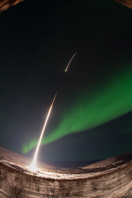 A NASA Rocket Soars Into An Emerald Aurora