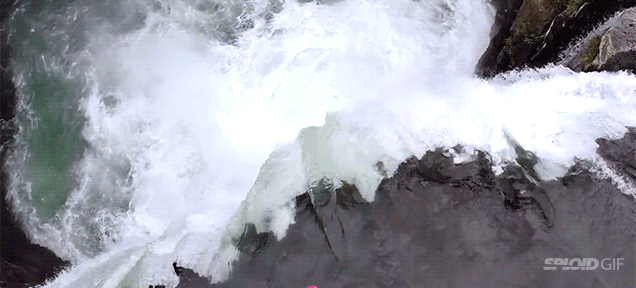 Fearless Guy In Kayak Drops Down A 60-foot Waterfall