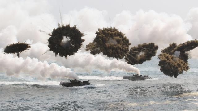 South Korean Marines Storm The Beach As Smoke Screens Explode Above Them During A Military Exercise
