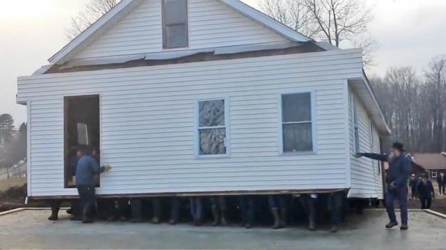 80 Bare-Handed Men Lift And Move An Entire House Into New Location