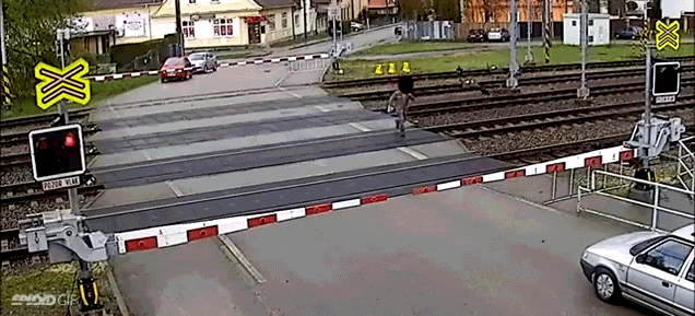 Holy Crap, Watch This Man Narrowly Escape Getting Hit By A Train
