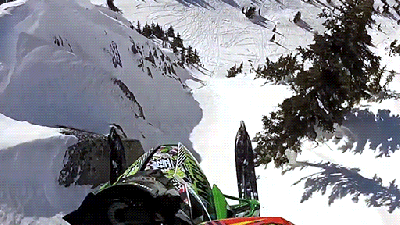 Watch This Snowmobile Launch Off A Cliff And Feel Your Stomach Drop