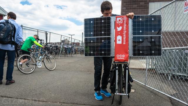 This Apocalypse-Ready Solar Charging Station Folds Up Behind A Bike