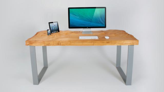 This Undulating Desk Top Has Specially Carved Crevices For Your Tech