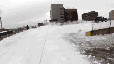 Urban Snowboarder Jumps From One Rooftop To Another In This Crazy Video