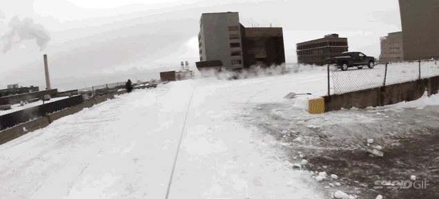 Urban Snowboarder Jumps From One Rooftop To Another In This Crazy Video