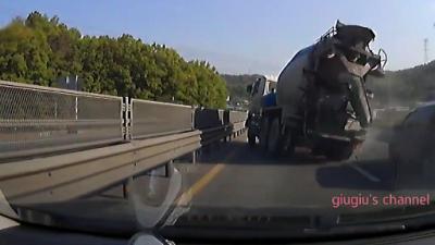 Cement Truck Narrowly Avoids Destroying Every Car On The Highway