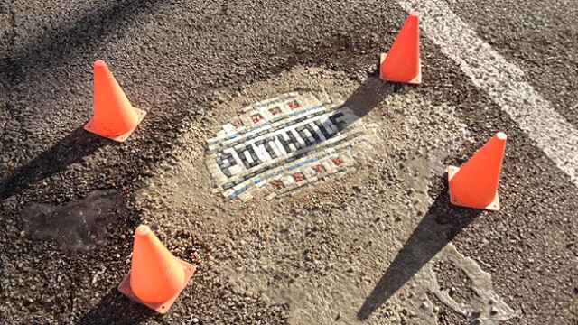 There’s A Joker Repairing Horrible Potholes With Mosaics