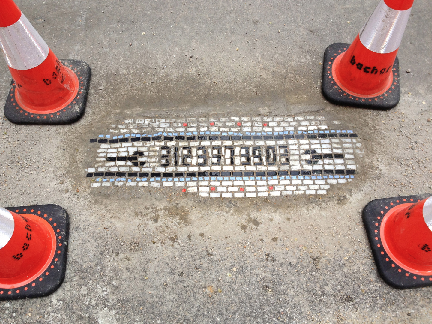 There’s A Joker Repairing Horrible Potholes With Mosaics