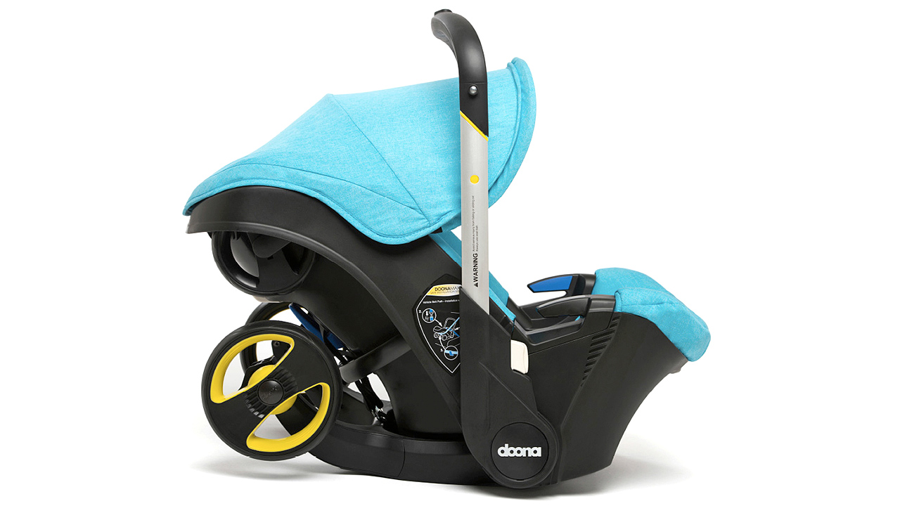 A Car Seat With Retractable Stroller Wheels Frees Up Boot Space