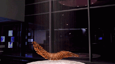 Watch This Cloud Of Rusty Balls Shape-Shift Into An Airborne Labyrinth