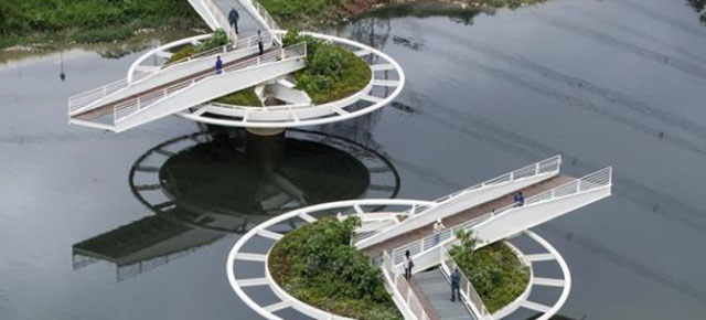 This Footbridge Spins Open On Two Giant Wheels To Let Boats Pass