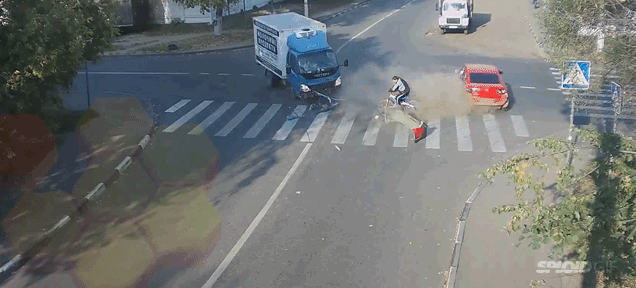 Cyclist Miraculously Escapes Death In Spectacular Traffic Accident