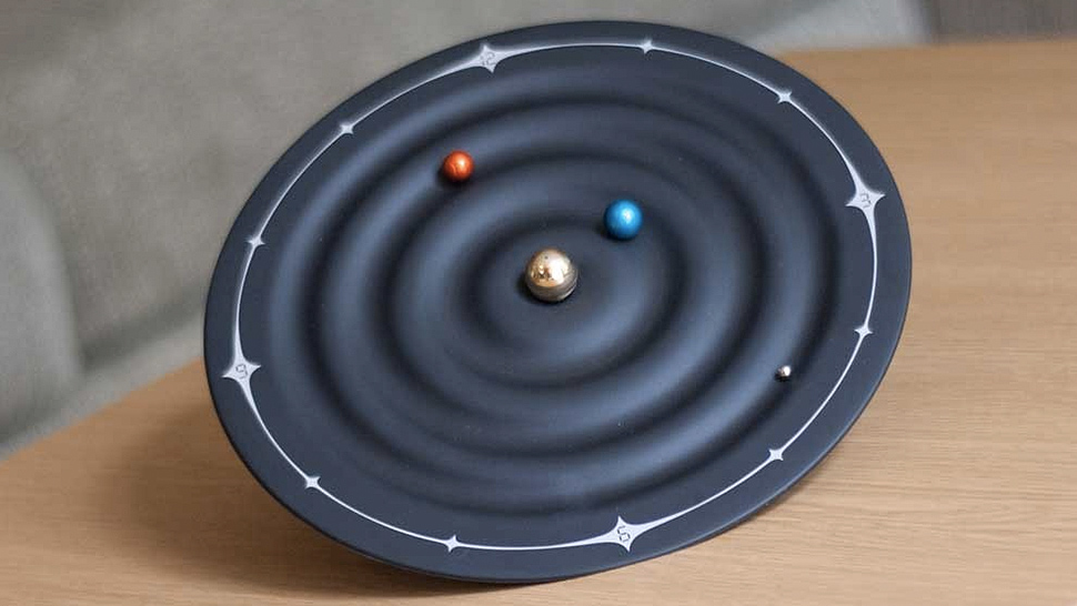 Tiny Orbiting Planets Tell The Time On This Solar System Clock