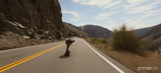 Skateboarder Zips Down Mountains And Flies By Cars At Insane Speeds