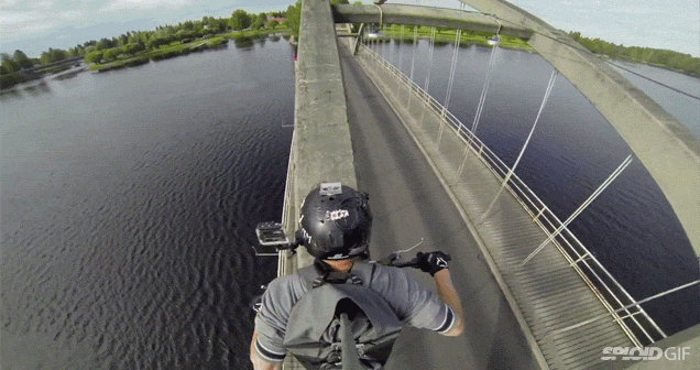 Mad Man Rides Motorcycle Over A Bridge’s Arch Beam
