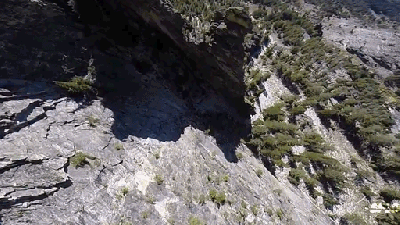 Wingsuit Guy Flies So Close To A Rock That He Could Light A Match On It