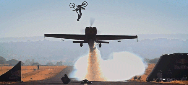 Insane Biker Backflips Over Flying Aeroplane In Incredibly Risky Stunt