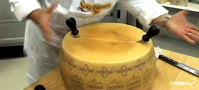 This Is How You Actually Break Open A Giant Italian Cheese