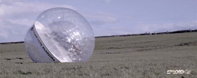 Crazy People Put Car Inside Giant Inflatable Ball, Roll It Down A Hill