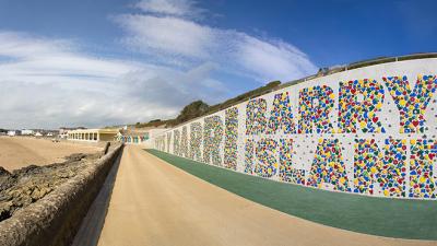 This Typographic Climbing Wall Stretches The Length Of A Beach