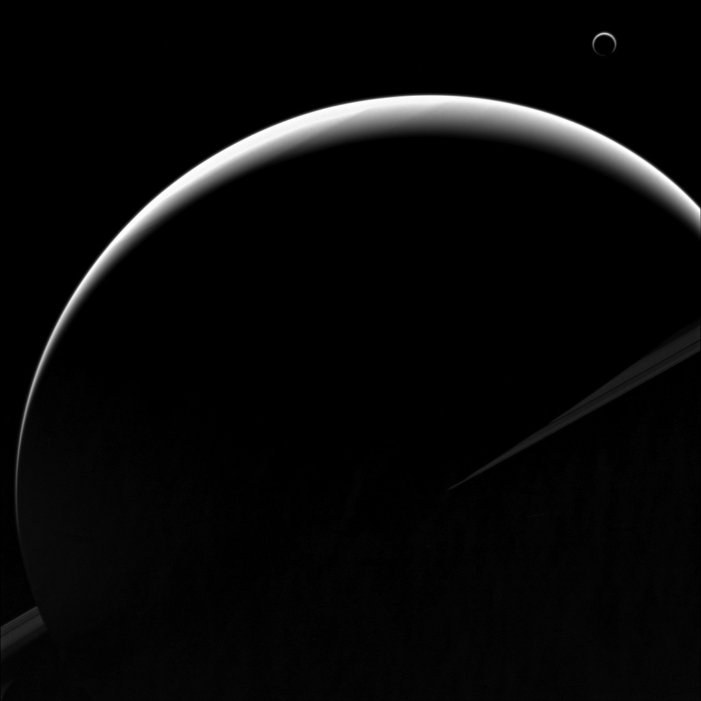Crescent Saturn And Its Crescent Moon