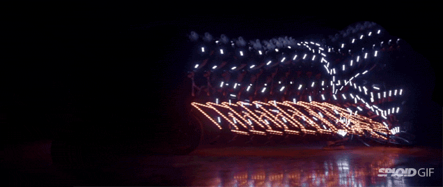 Watching These Cyclists Spin Around In Light Suits Is So Mesmerising