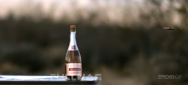 Guy Perfectly Uncorks A Champagne Bottle With A Tactical Rifle