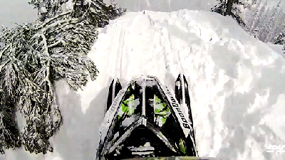 These Snowmobile Vertical Drops Look Like An Insane Snow Rollercoaster