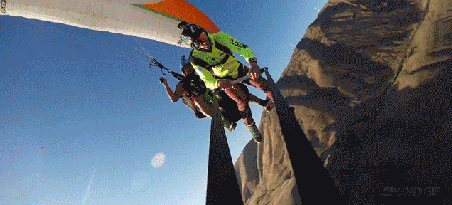Crazy Dude Jumps And Swings From A Rope Hanging From A Paraglider