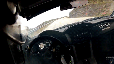 Mad Race Driver Drifting Near A Cliff On A Mountain Pass