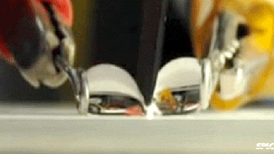 Watch A Super Hydrophobic Knife Cut Through A Water Droplet