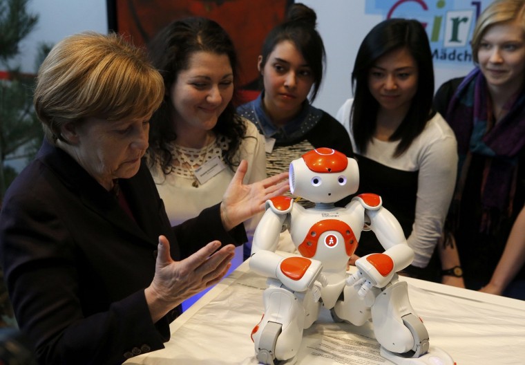 Why Is Angela Merkel Always Palling Around With Robots?
