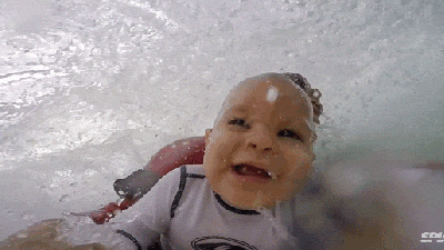 Awesomely Cute Baby Surfs With His Dad For The First Time