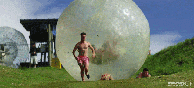 Watching People Get Run Over By A Giant Rolling Bubble Ball Is So Funny
