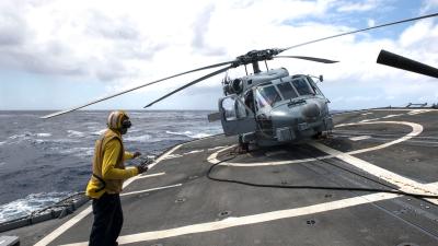 Crazy Angle Of A US Navy Helicopter On A Guided-Missile Cruiser