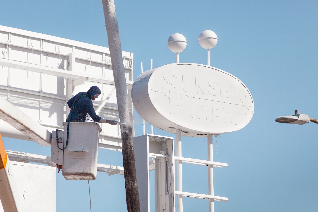 Why An Artist Totally Whitewashed This Motel — Palm Trees And All