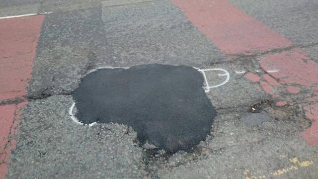 Spray-Painting Phalluses On Potholes Is One Way To Get Them Fixed
