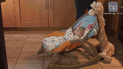 This Plush Giraffe Will Rock Your Kids To Sleep For You